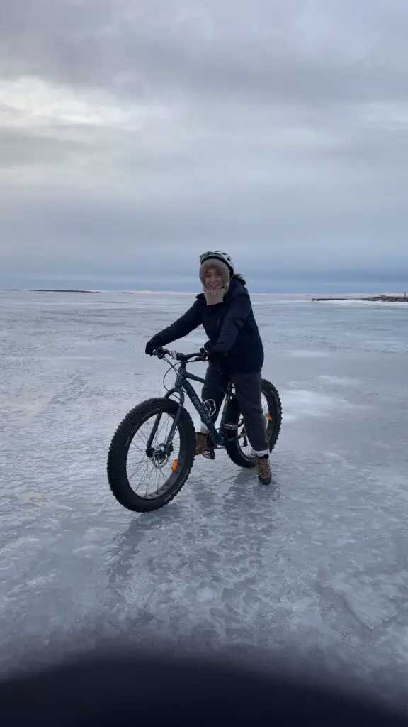 Holly is on an ebike on a frozen lake in Oulu. it is really icy